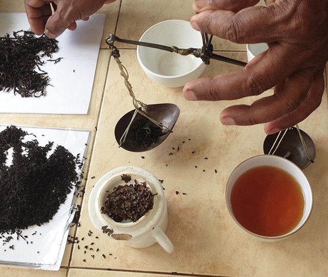 On our last trip to Sri Lanka, we took this photo of the plantation manager, as he showed us a traditional weighing method for tasting high grown Uva tea